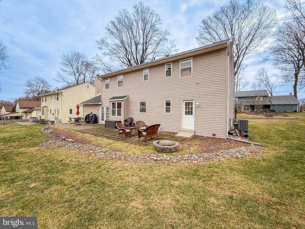 738 Bridgeview Road Feasterville-Trevose, PA 19053 - Photo 53 of 54 a view of a backyard with table and chairs under an umbrella