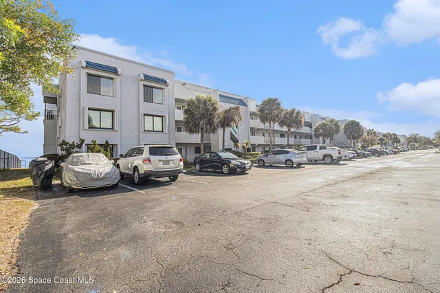 a view of a cars parked in front of a building