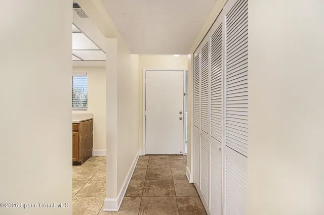 a view of a bathroom from a hallway