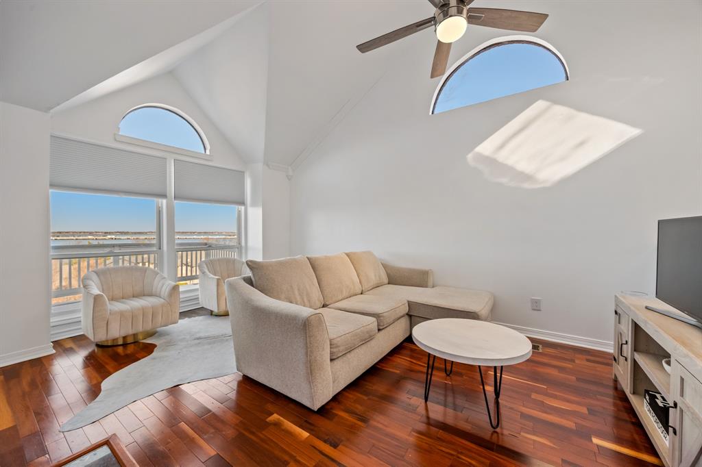 5422 Ranger Drive Rockwall, TX 75032 - Photo 12 of 32 a living room with furniture fireplace and a large window