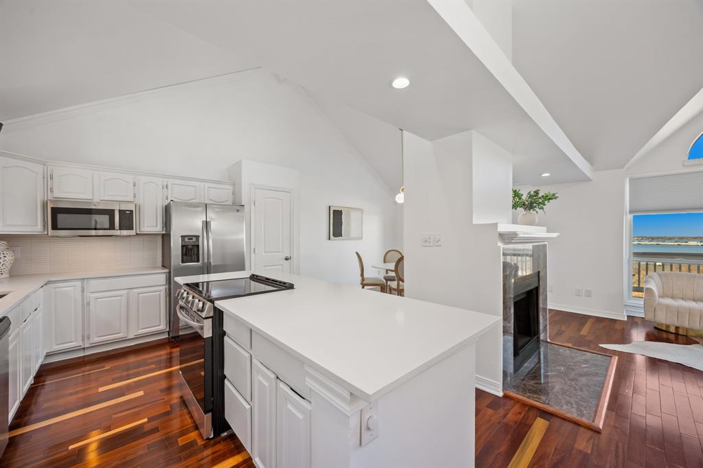 5422 Ranger Drive Rockwall, TX 75032 - Photo 15 of 32 a kitchen with a sink a stove and refrigerator