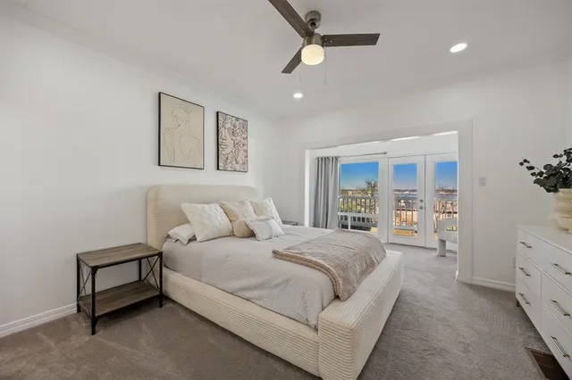 a spacious bedroom with a large bed and a window