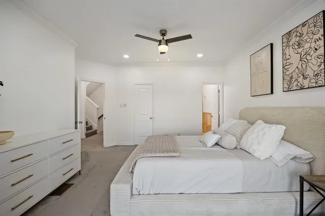 a bedroom with a bed and a dresser