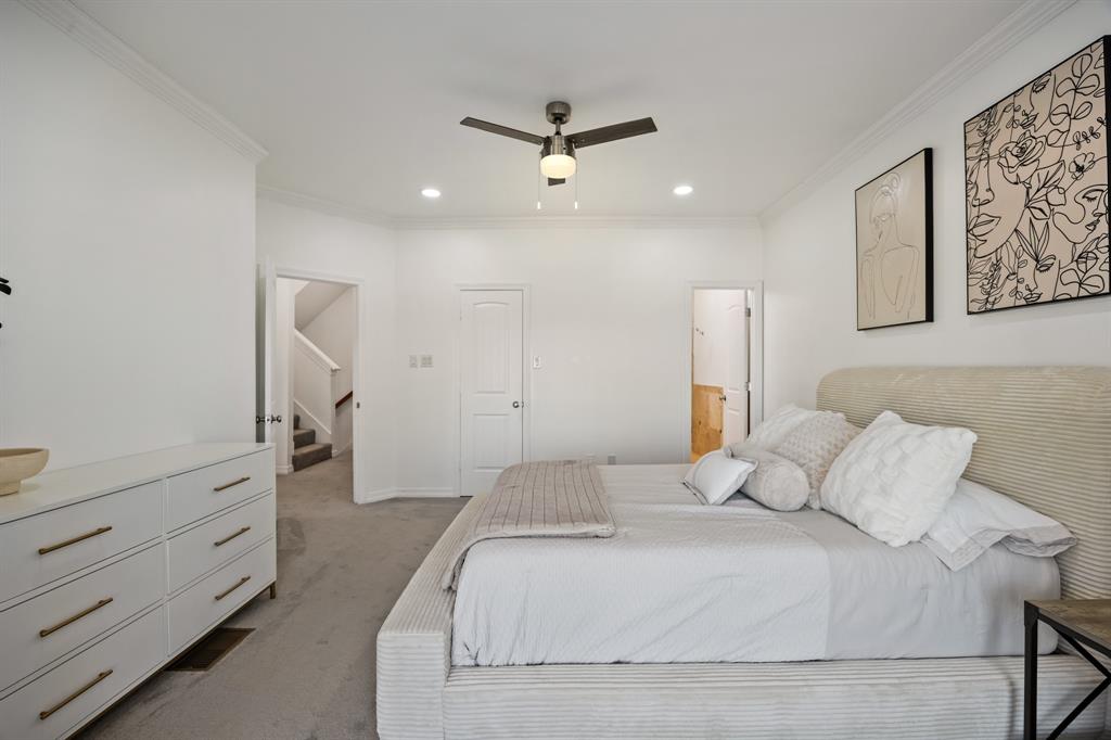 5422 Ranger Drive Rockwall, TX 75032 - Photo 19 of 32 a bedroom with a bed and a dresser