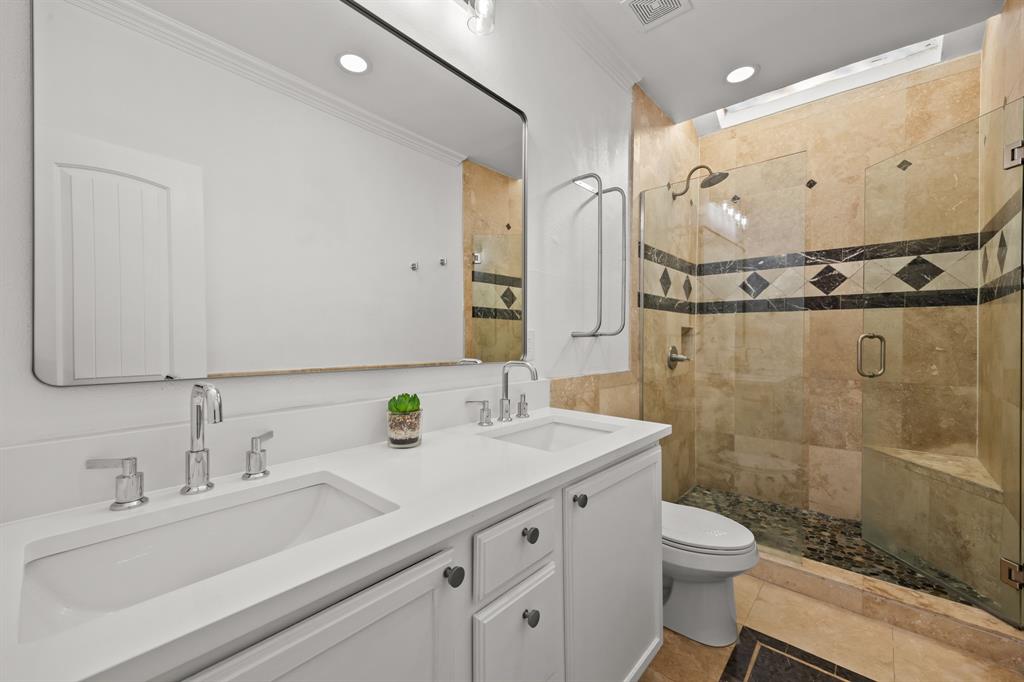 5422 Ranger Drive Rockwall, TX 75032 - Photo 21 of 32 a bathroom with a sink a toilet and shower