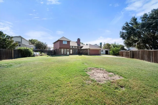 a view of a house with a big yard