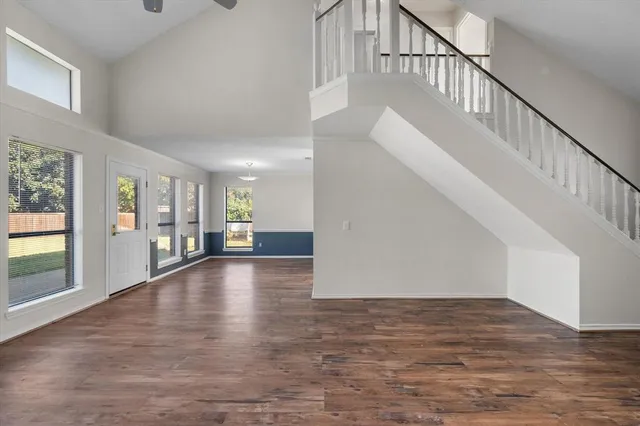 a view of an entryway with wooden floor