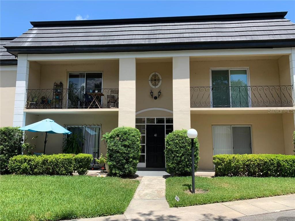 1500 Gay Road, Unit 10 Winter Park, FL 32789 - Photo 1 of 1 a view of a house with brick walls and a yard