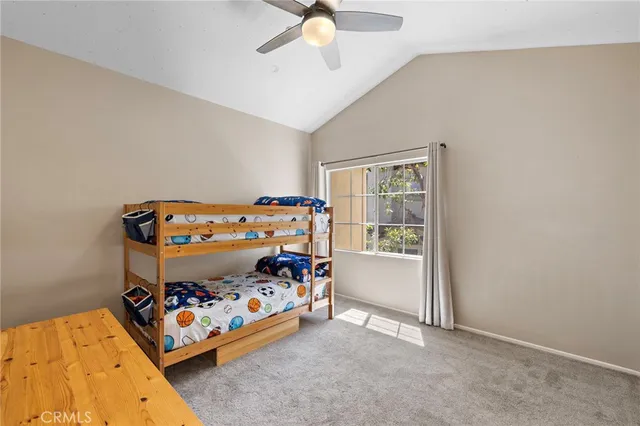 a bed room with a bed and a baby bed