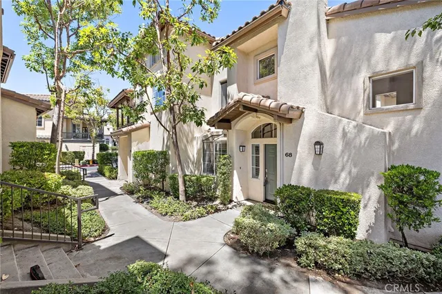 a view of a brick house with a yard