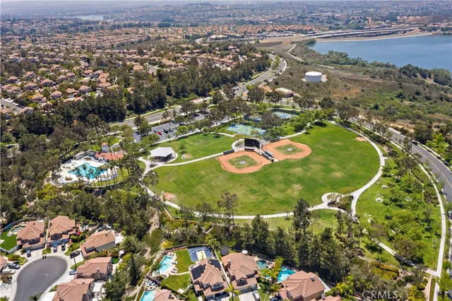 an aerial view of a residential houses with outdoor space