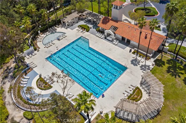 an aerial view of a house swimming pool and outdoor seating