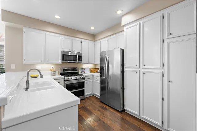 a kitchen with a refrigerator sink and microwave