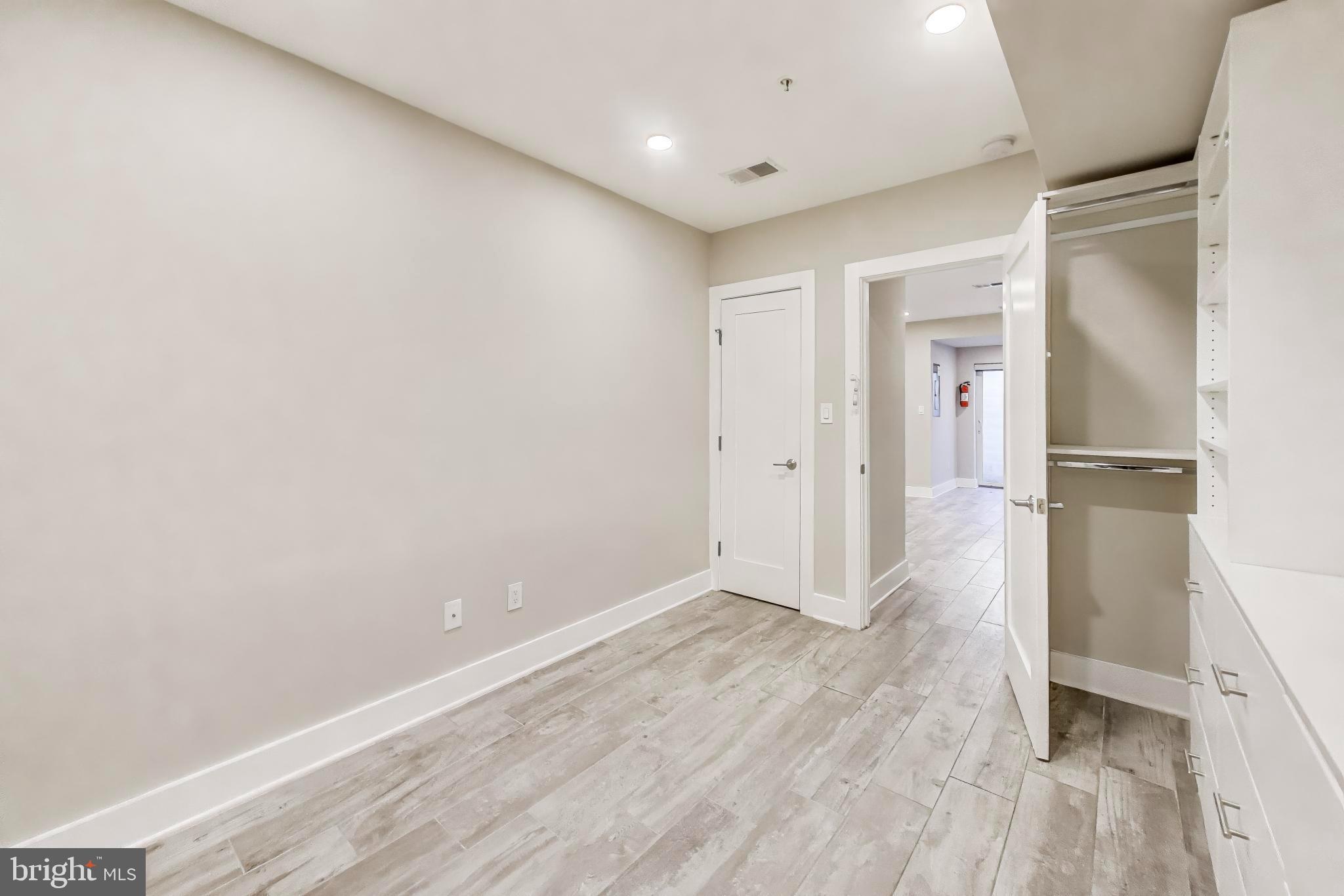 1444 Harvard Street Northwest, Unit 1 Washington, DC 20009 - Photo 12 of 19 Spacious, modern room with natural light.
