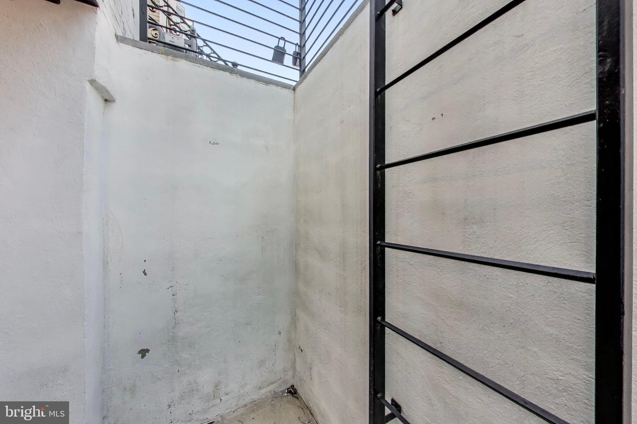 1444 Harvard Street Northwest, Unit 1 Washington, DC 20009 - Photo 18 of 19 Urban retreat with modern privacy features.