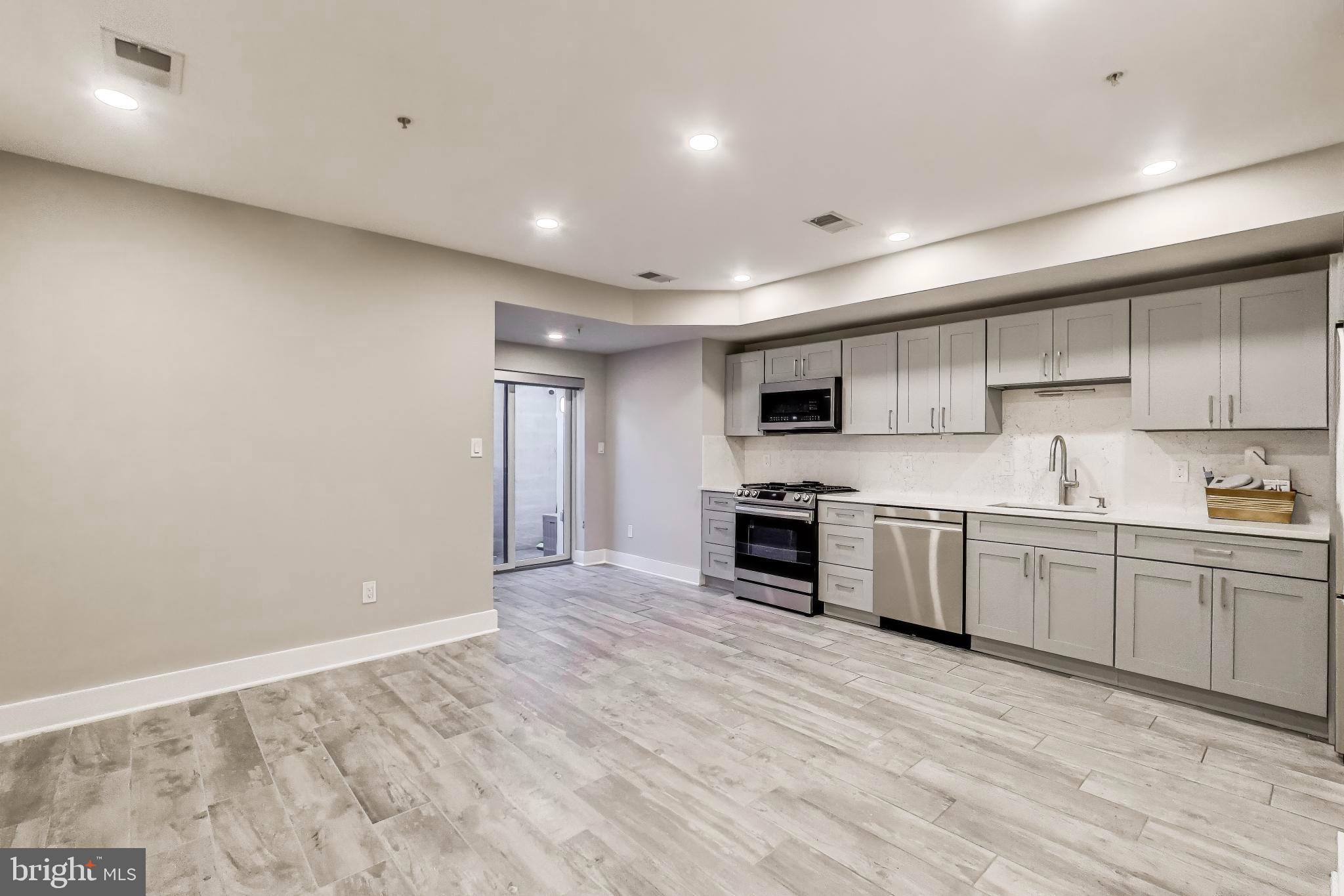 1444 Harvard Street Northwest, Unit 1 Washington, DC 20009 - Photo 6 of 19 Modern kitchen with sleek finishes.