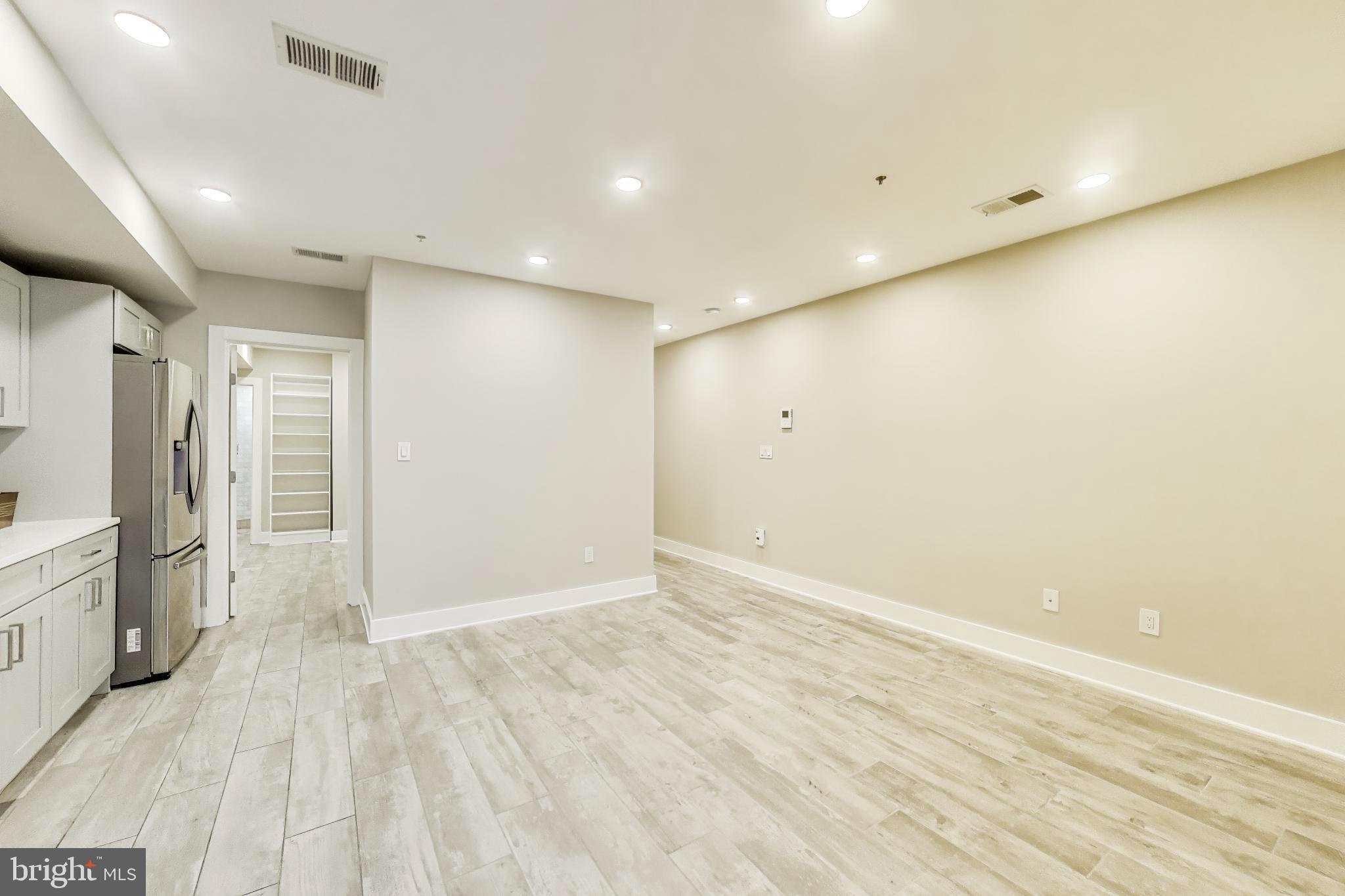 1444 Harvard Street Northwest, Unit 1 Washington, DC 20009 - Photo 8 of 19 Spacious, modern living area with sleek design.