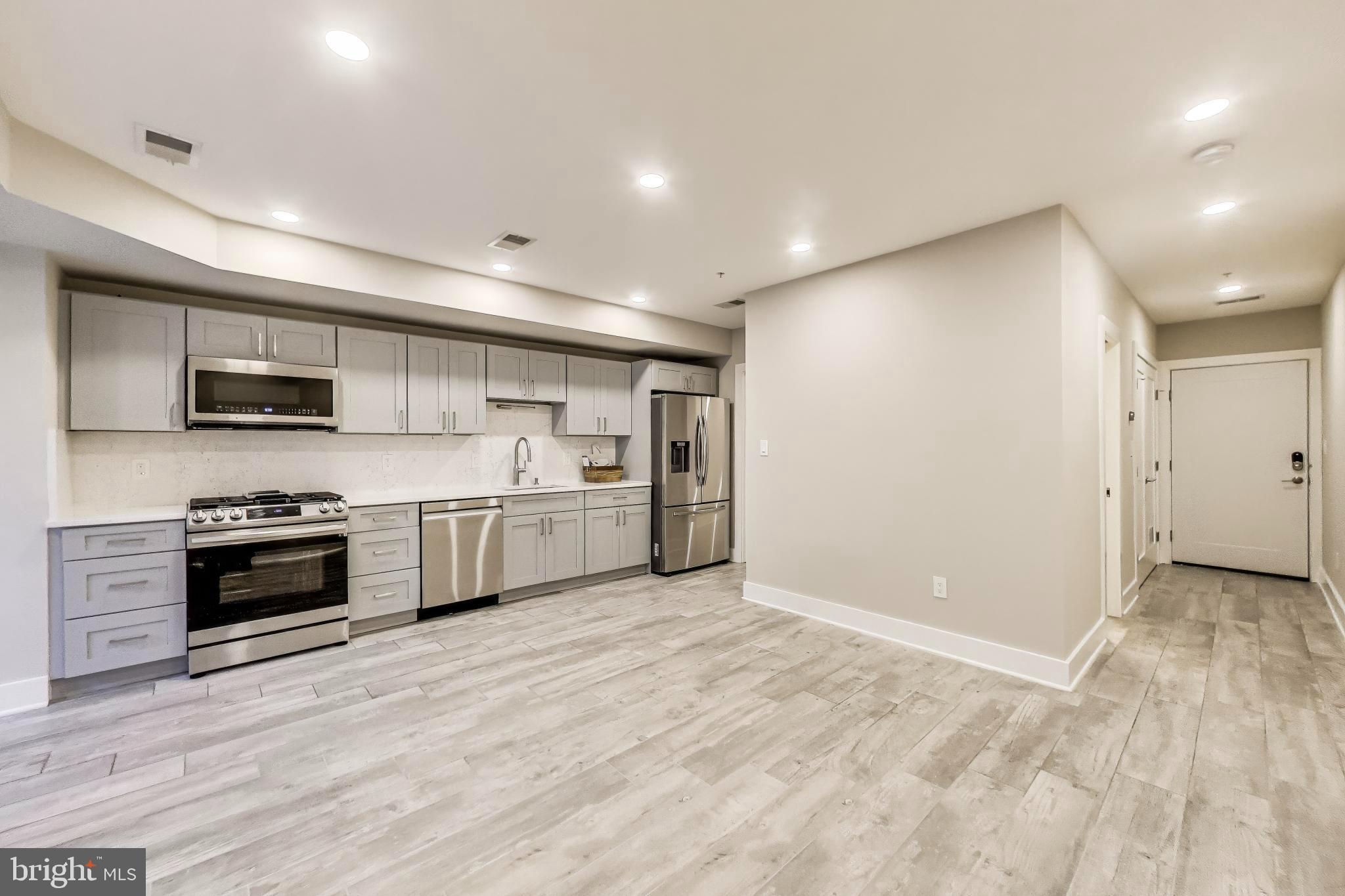 1444 Harvard Street Northwest, Unit 1 Washington, DC 20009 - Photo 9 of 19 Modern kitchen with sleek finishes.