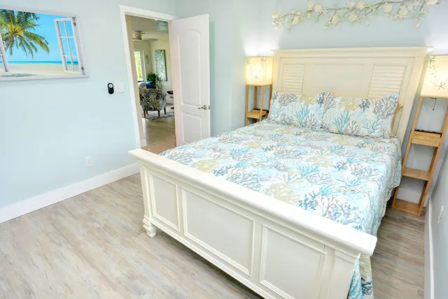 a room with wooden floor and painting on the wall