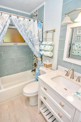 a bathroom with a sink a toilet and a bathtub