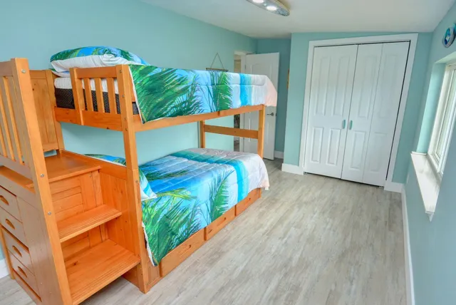 a bedroom with a bed and a walk in closet