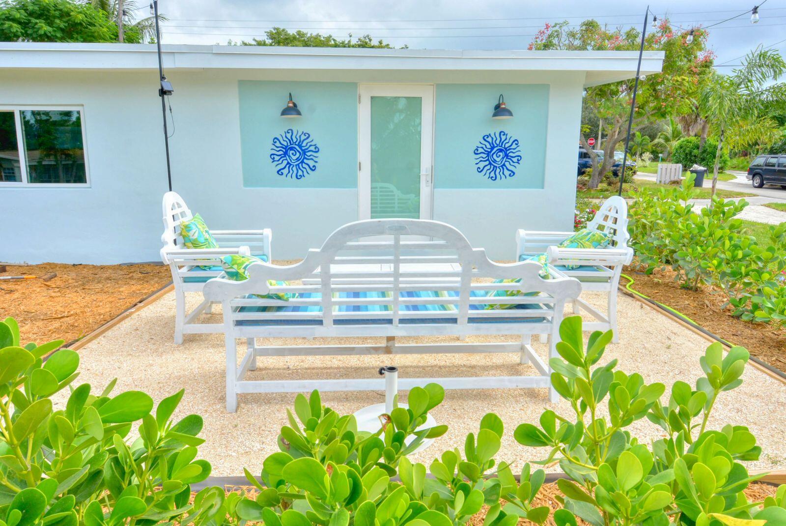 1315 Northeast Flora Place Jensen Beach, FL 34957 - Photo 5 of 27 a view of a swimming pool with a lounge chair