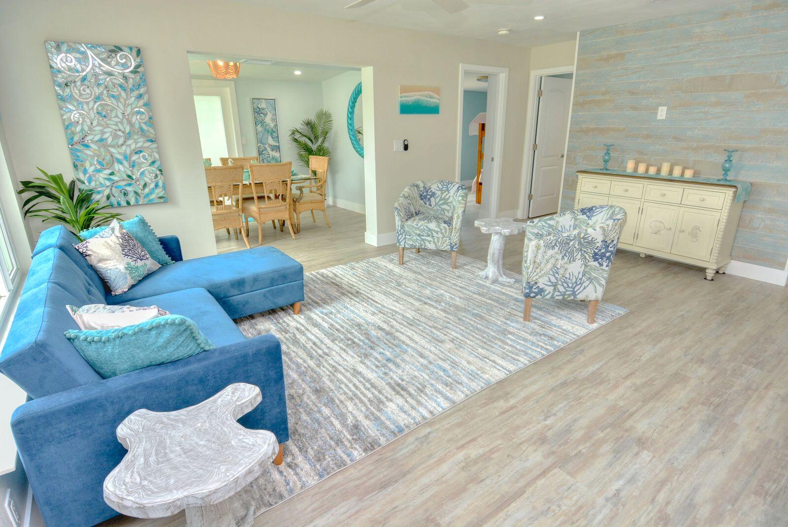 1315 Northeast Flora Place Jensen Beach, FL 34957 - Photo 7 of 27 a living room with furniture and a wooden floor