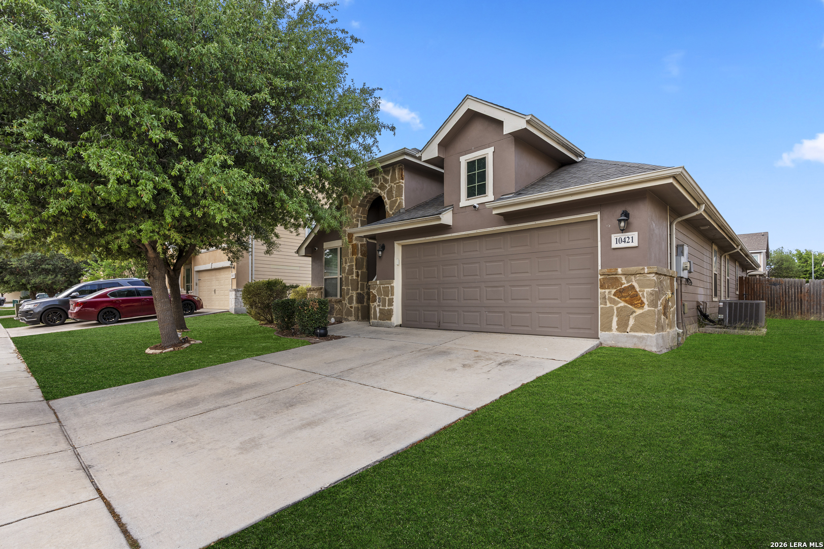 10421 Macarthur Way Converse, TX 78109 - Photo 1 of 26 a front view of a house with a yard and garage