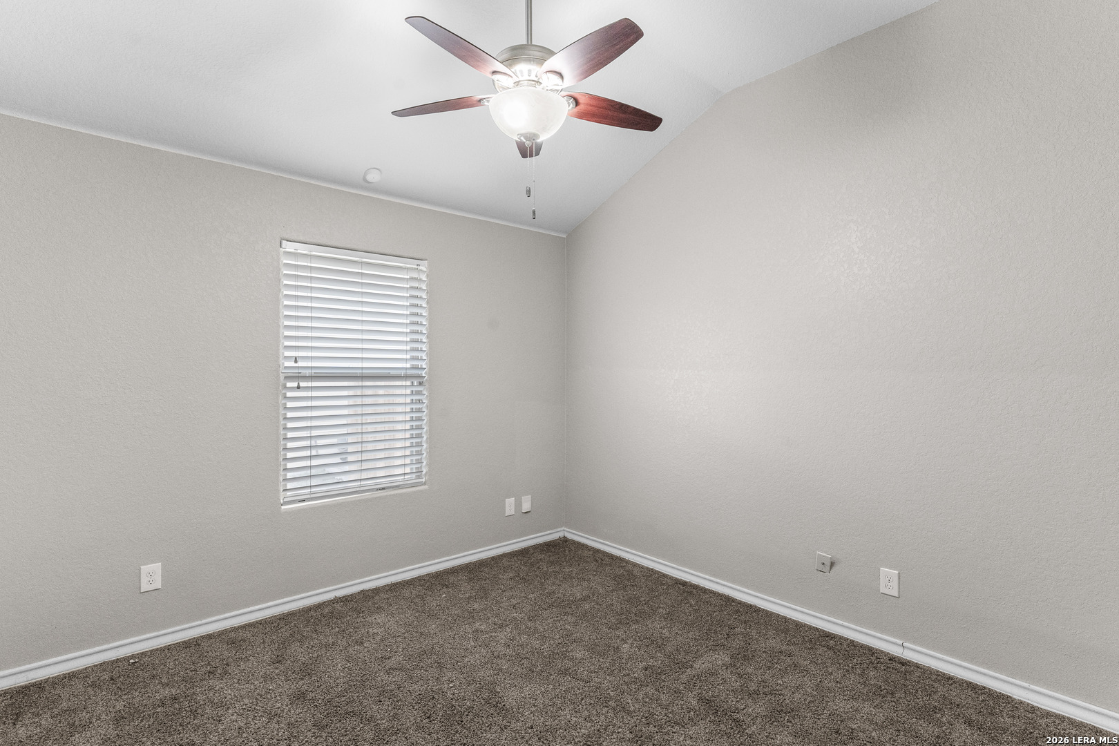 10421 Macarthur Way Converse, TX 78109 - Photo 20 of 26 an empty room with a window and a fan