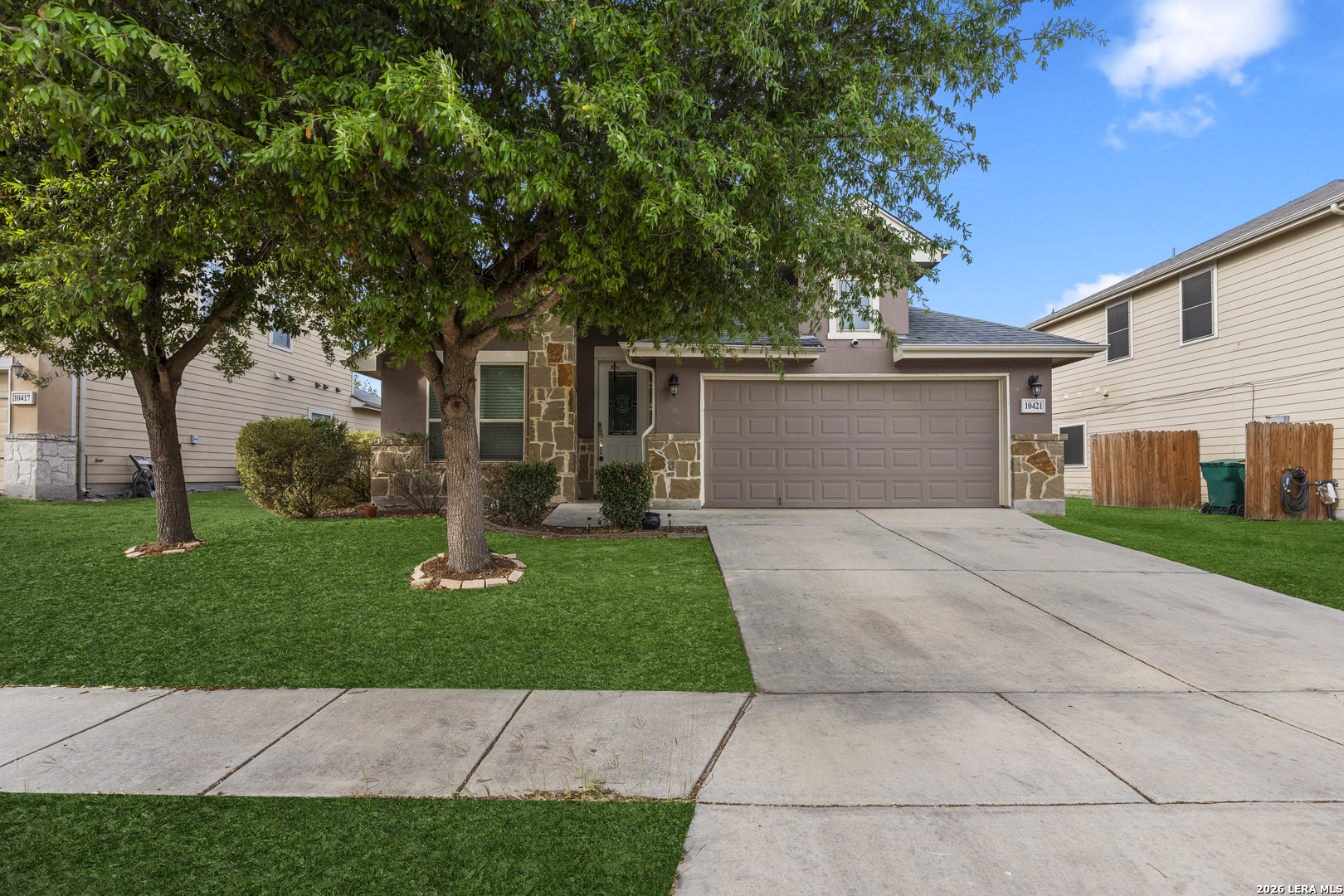 10421 Macarthur Way Converse, TX 78109 - Photo 2 of 26 a front view of a house with garden