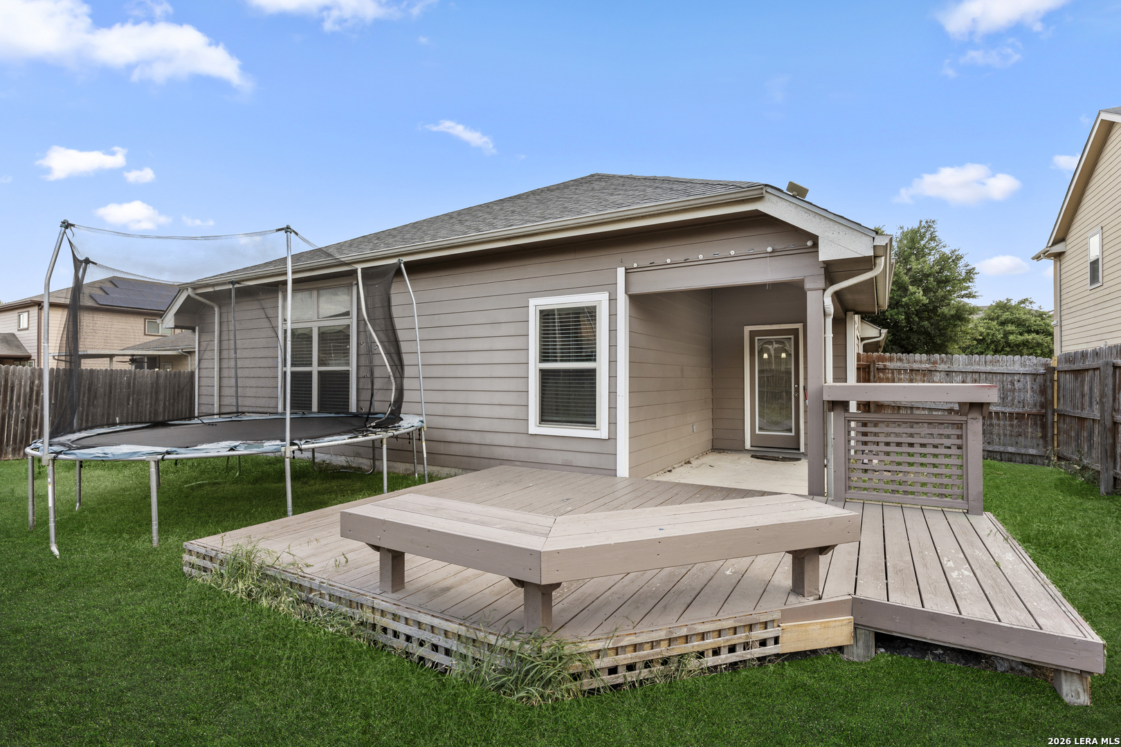 10421 Macarthur Way Converse, TX 78109 - Photo 25 of 26 a view of house with backyard and outdoor seating
