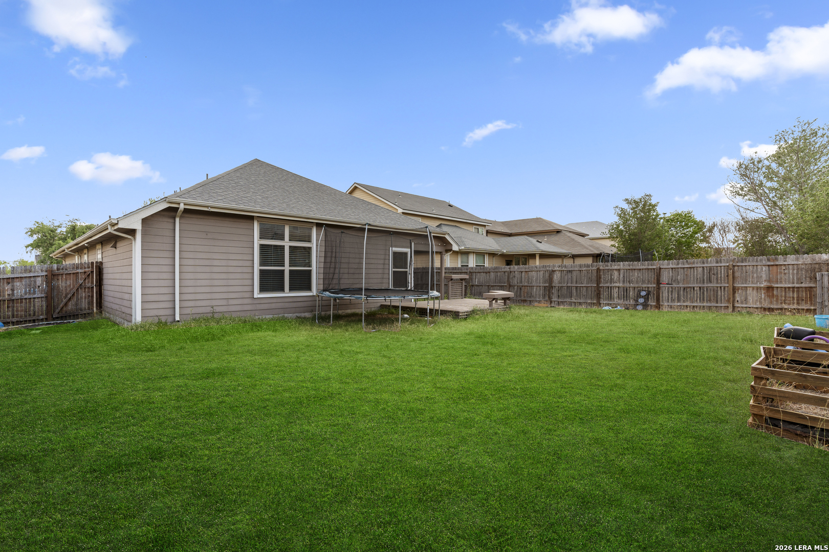 10421 Macarthur Way Converse, TX 78109 - Photo 26 of 26 a front view of a house with a garden