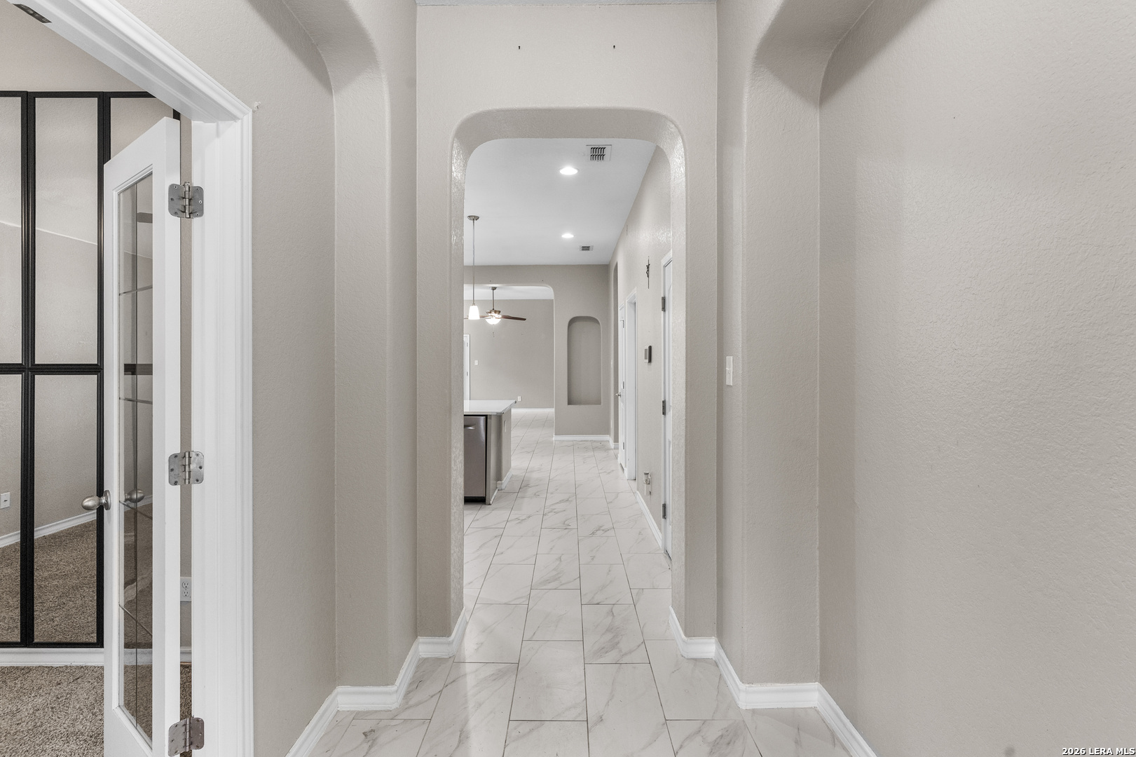 10421 Macarthur Way Converse, TX 78109 - Photo 4 of 26 a view of a bathroom from a hallway