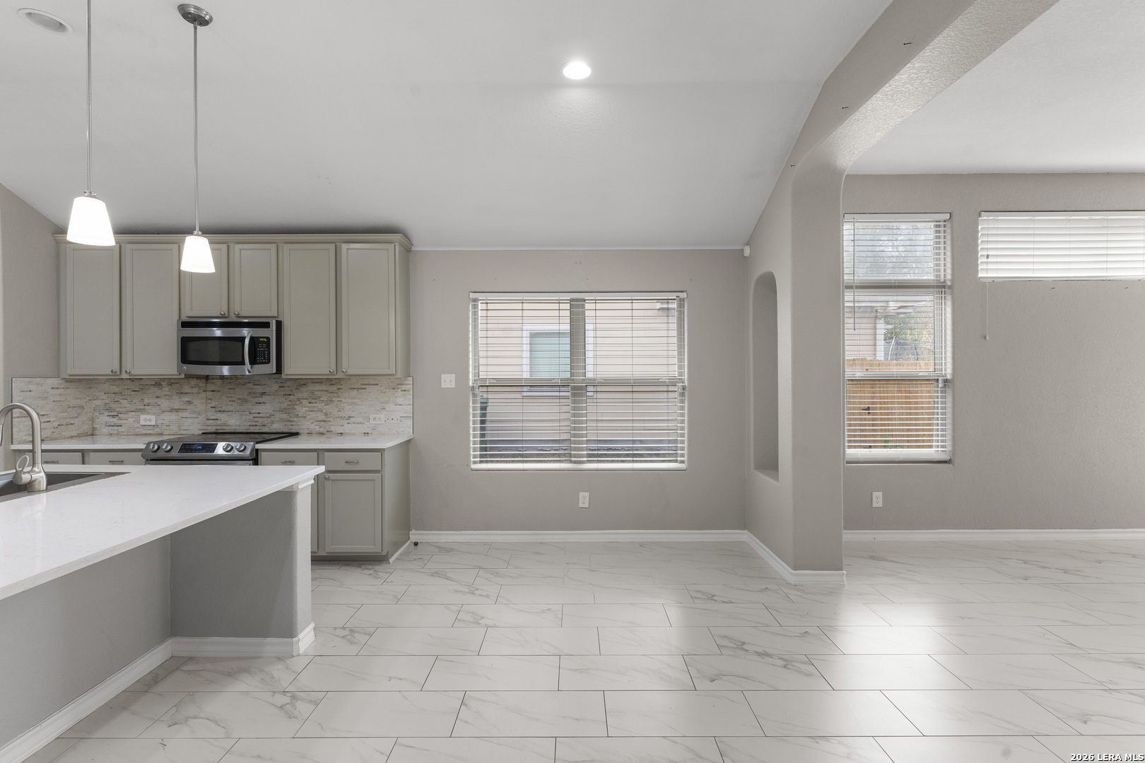 10421 Macarthur Way Converse, TX 78109 - Photo 10 of 26 a kitchen with a sink cabinets and window