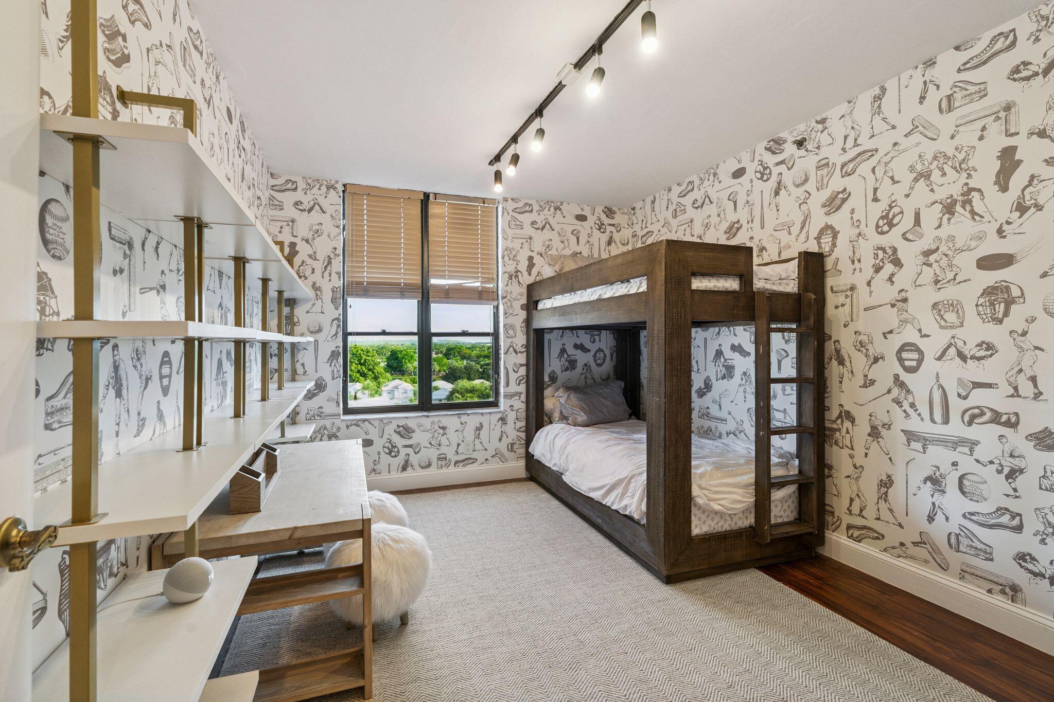 7217 Promenade Drive, Unit 801 Boca Raton, FL 33433 - Photo 20 of 39 a living room with furniture a flat screen tv and a floor to ceiling window