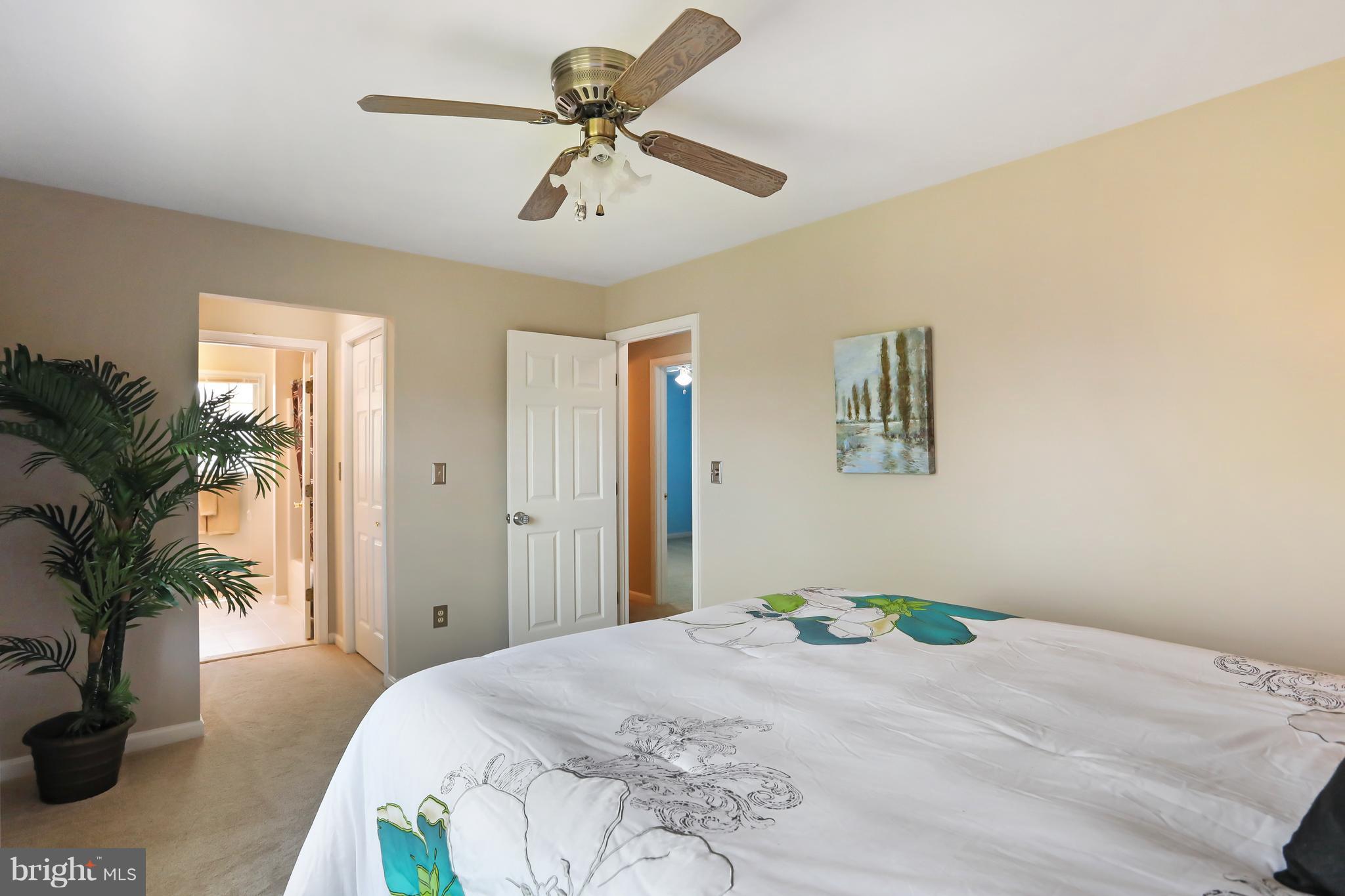 1603 Gibbons Road Point of Rocks, MD 21777 - Photo 22 of 29 a bedroom with a bed and a potted plant