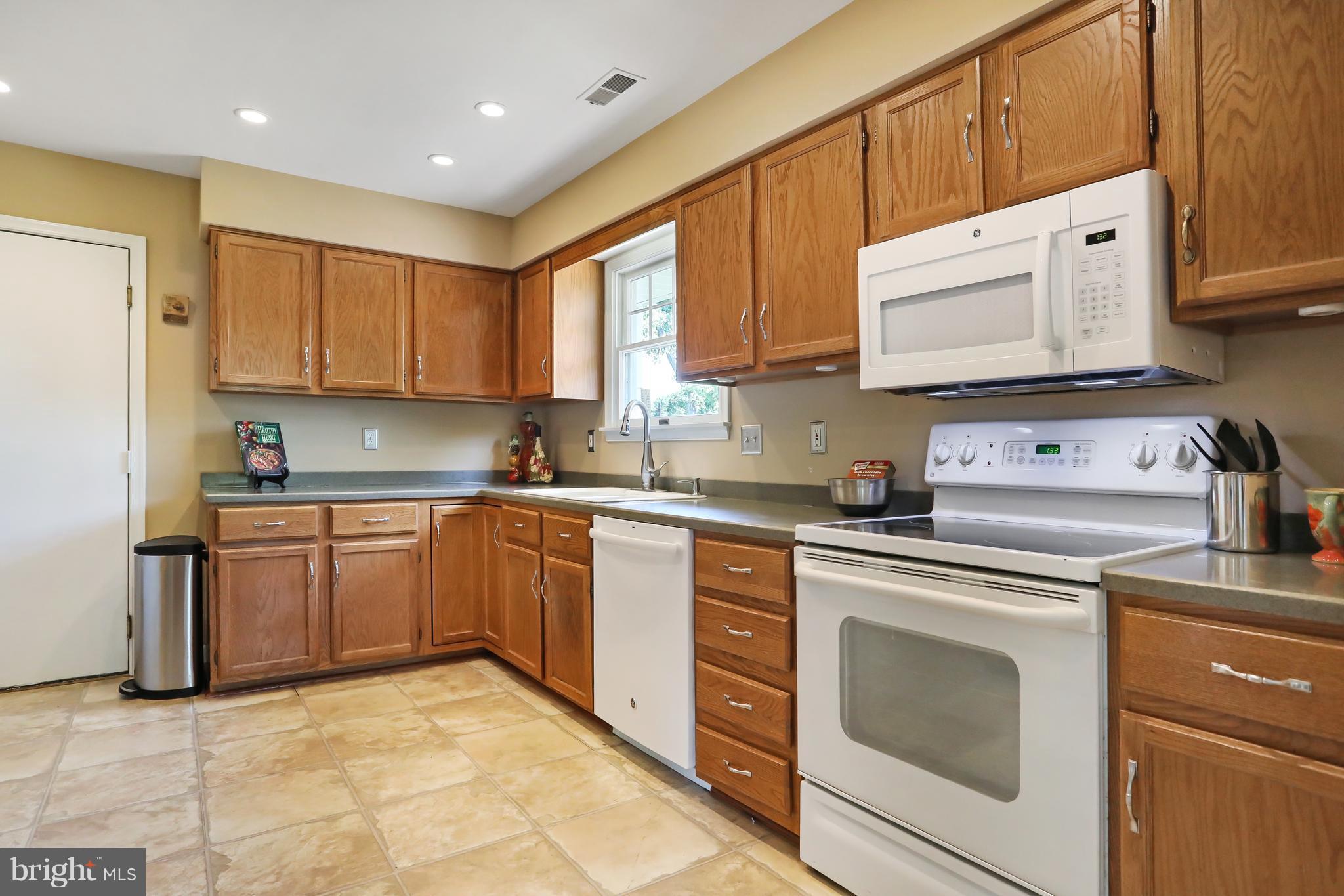 1603 Gibbons Road Point of Rocks, MD 21777 - Photo 8 of 29 a kitchen with granite countertop a stove sink and cabinets