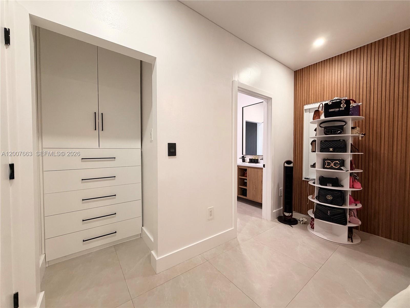 86 Northwest 4th Street Homestead, FL 33030 - Photo 12 of 22 wooden view of walk in closet