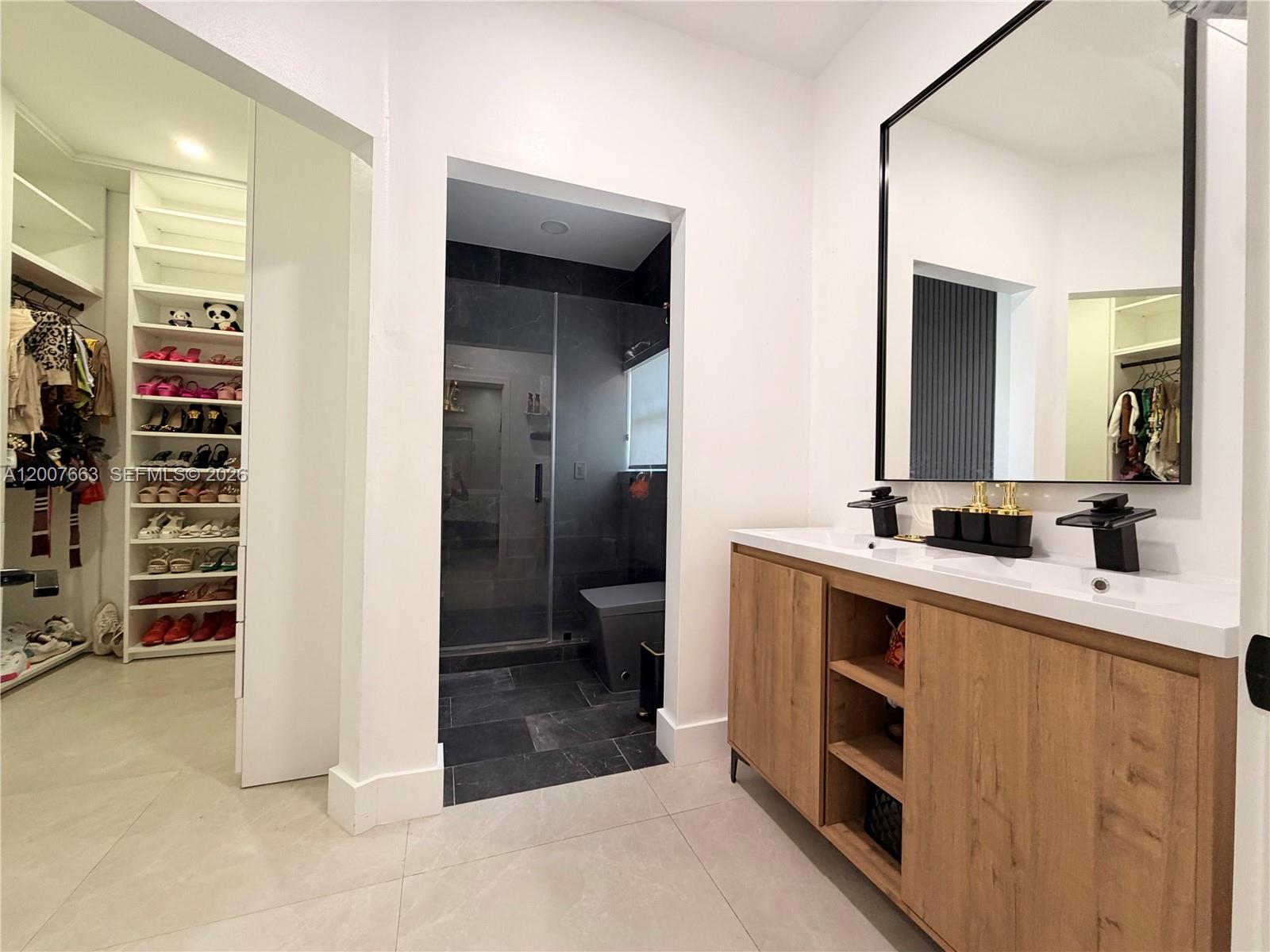 86 Northwest 4th Street Homestead, FL 33030 - Photo 13 of 22 a bathroom with a sink and a mirror