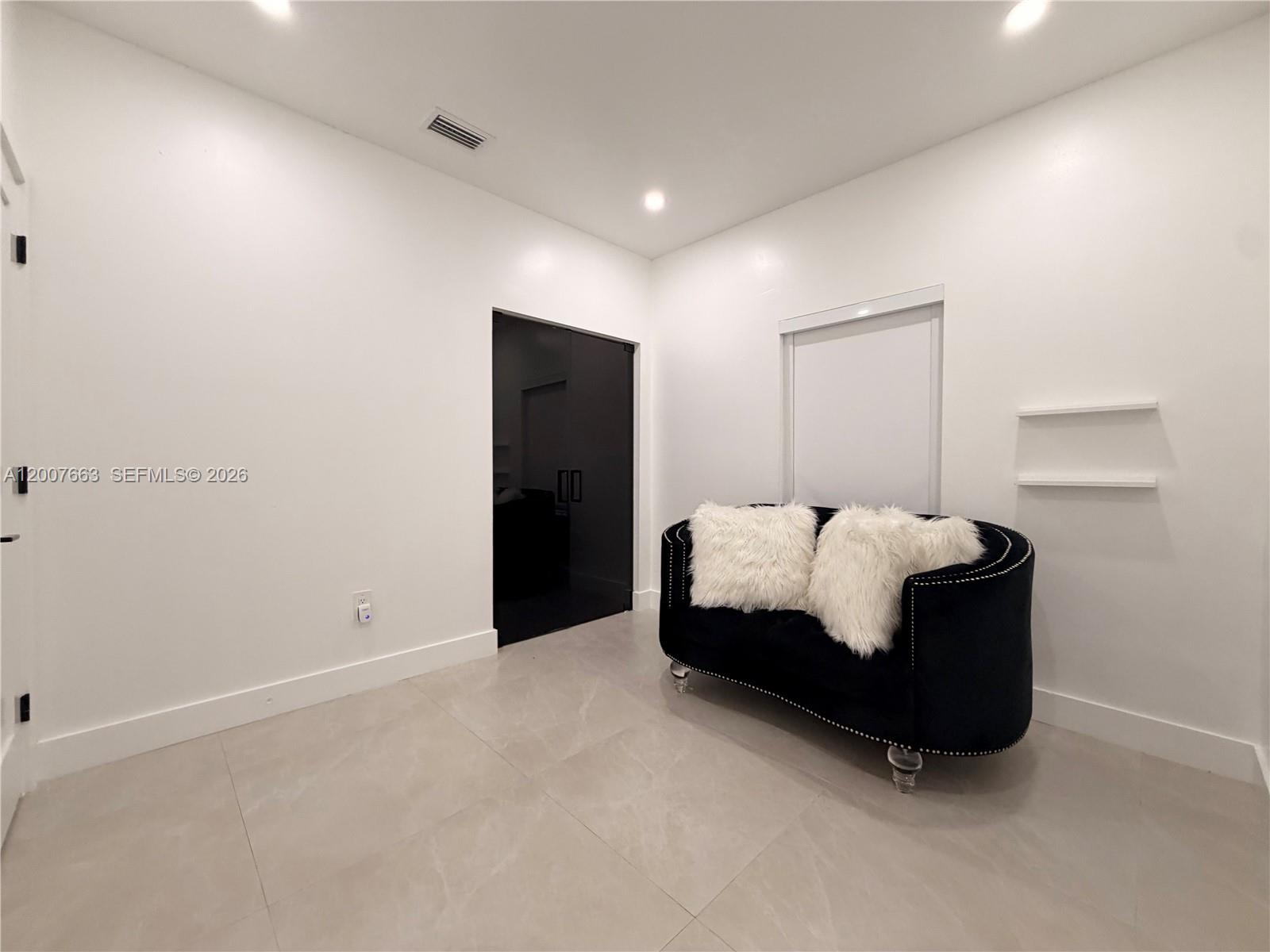86 Northwest 4th Street Homestead, FL 33030 - Photo 15 of 22 a spacious bedroom with a bed and a window