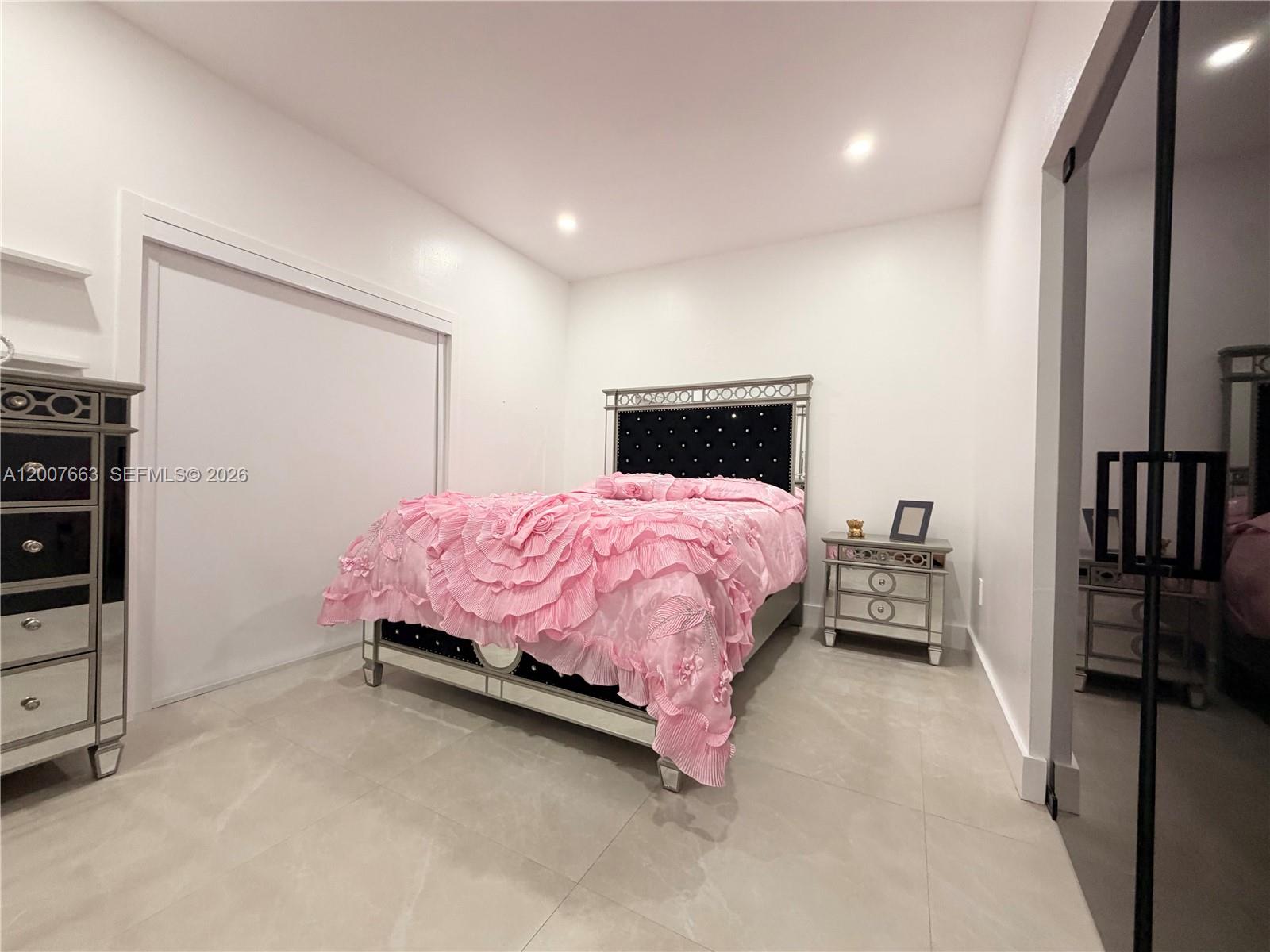 86 Northwest 4th Street Homestead, FL 33030 - Photo 16 of 22 a bedroom with a bed and a closet