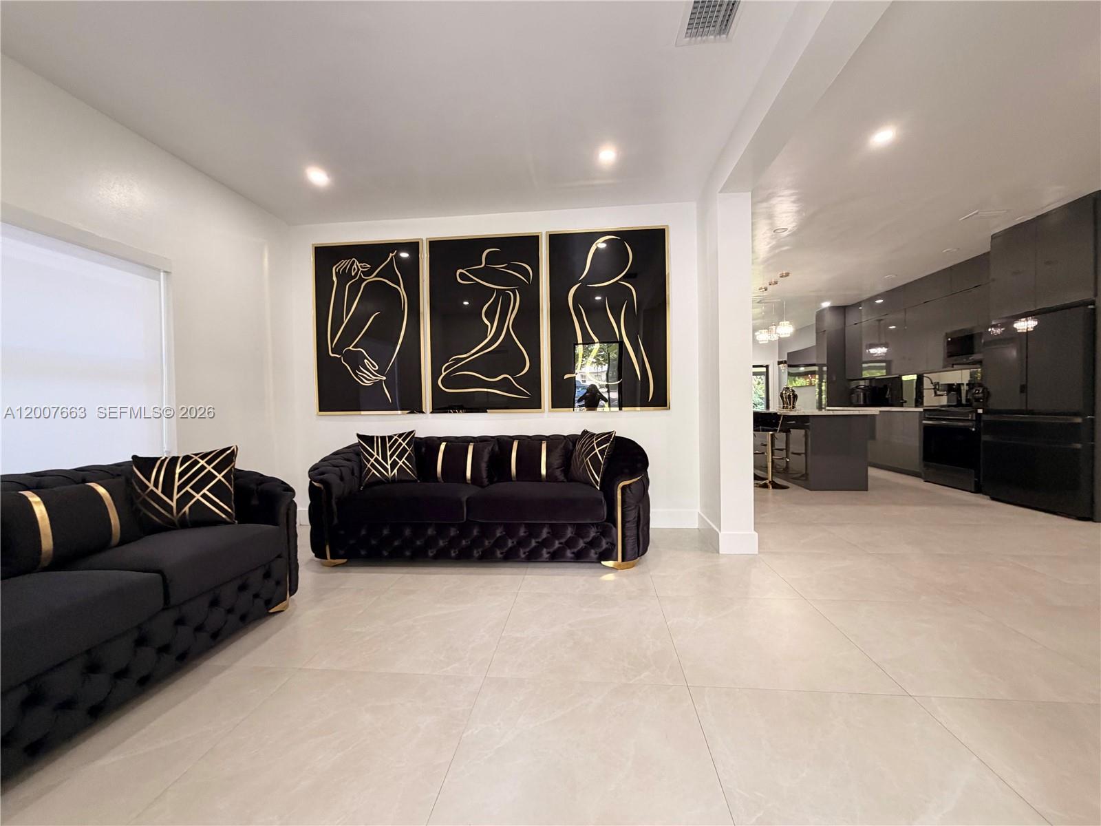 86 Northwest 4th Street Homestead, FL 33030 - Photo 2 of 22 a living room with furniture window and couch