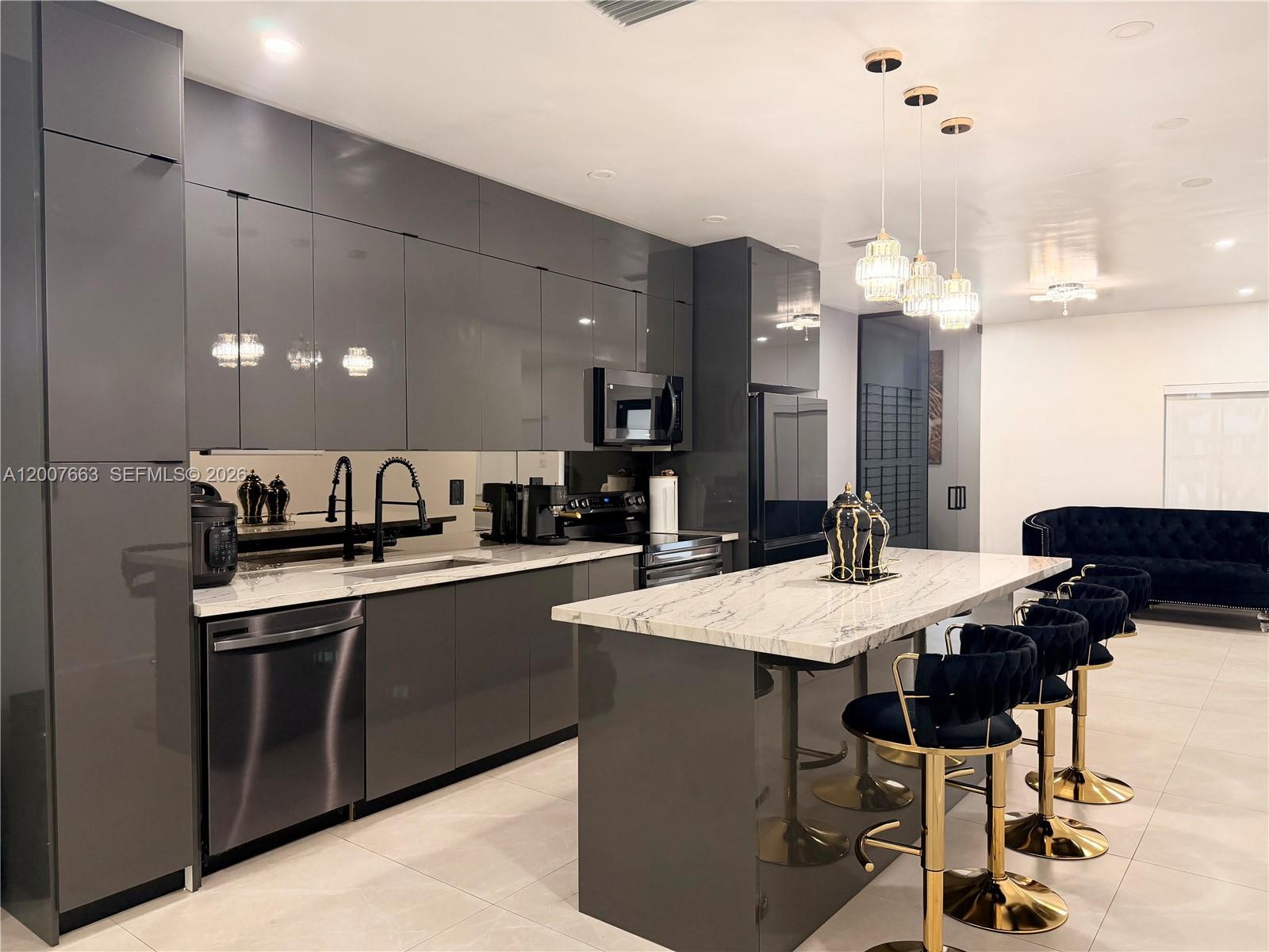 86 Northwest 4th Street Homestead, FL 33030 - Photo 8 of 22 a large kitchen with a table and chairs in it