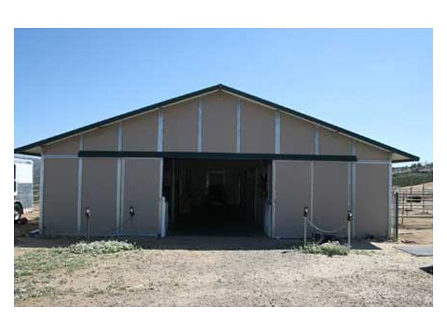 20944 Windle View Road Ramona, CA 92065 - Photo 16 of 25 MD barn 36 x 48 wth 8 stalls that all have doors to outside runs