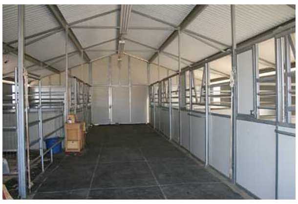 20944 Windle View Road Ramona, CA 92065 - Photo 17 of 25 Barn interior. Aisleway and all stalls have rubber stall mats
