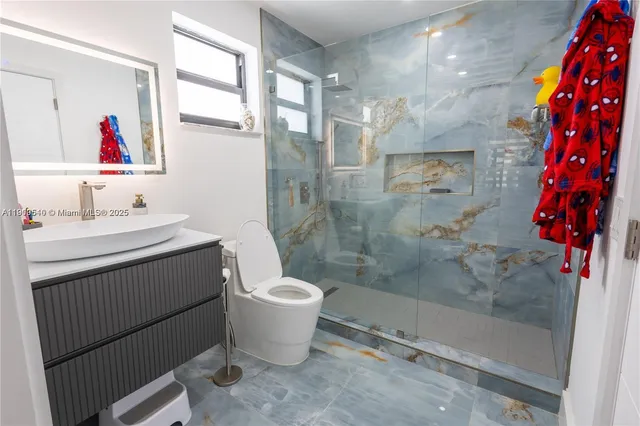 a bedroom with toys and a window in it