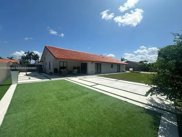 a view of a house with a back yard