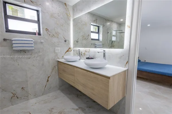 a bathroom with a sink and a mirror