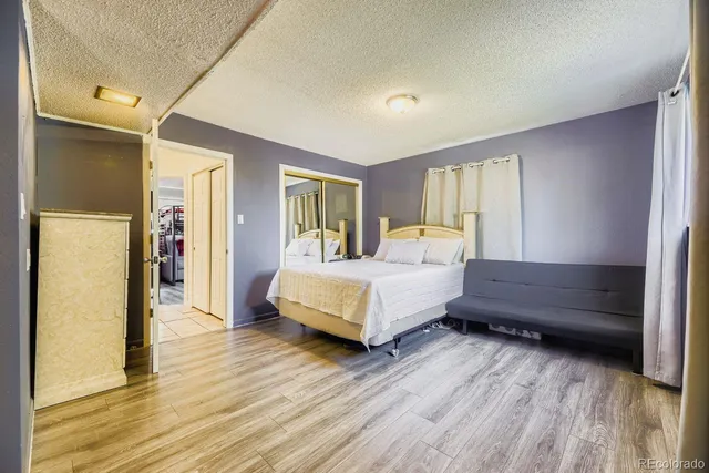 a bathroom with a sink a toilet and a shower