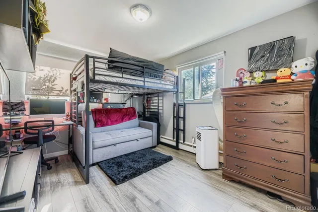 a bedroom with furniture and a gym equipment